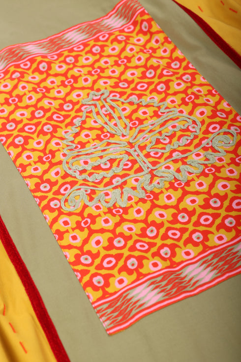 Reversible oversized coverup with one plain and one printed side