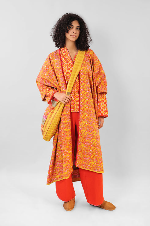 Reversible oversized coverup with one plain and one printed side