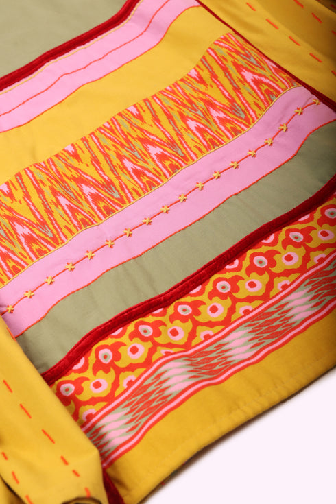 Reversible oversized coverup with one plain and one printed side