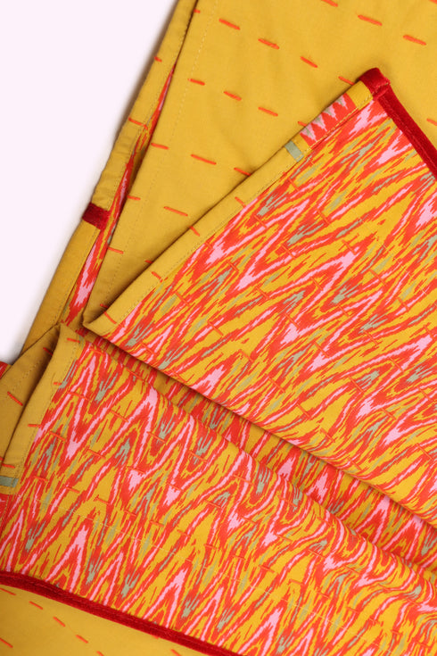 Reversible oversized coverup with one plain and one printed side