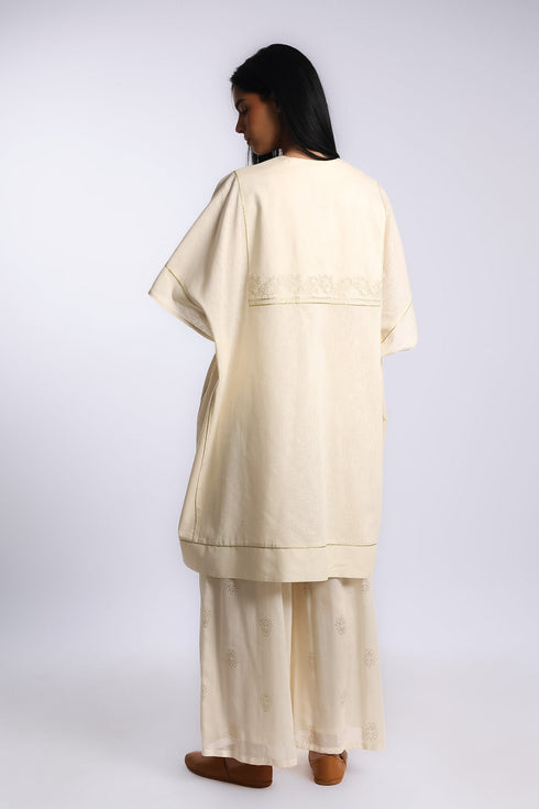 Loose fit coverup in linen and cotton with front and back bib