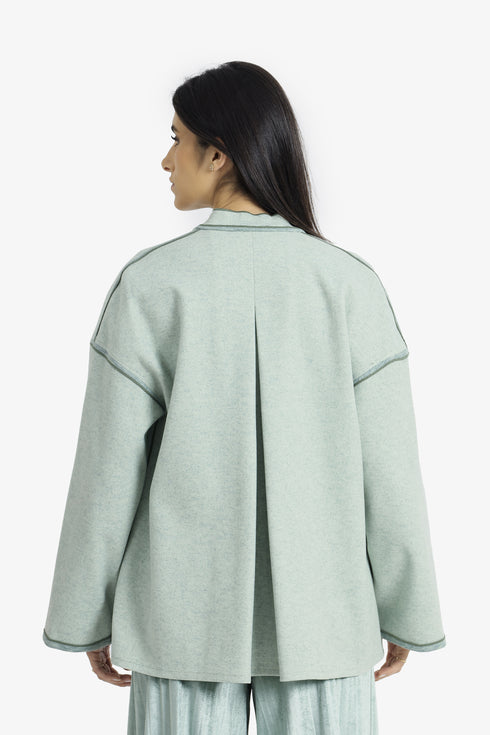 Reversible short jacket with front pocket