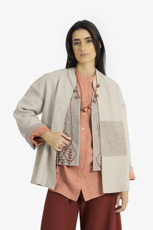 Reversible short jacket with front pocket