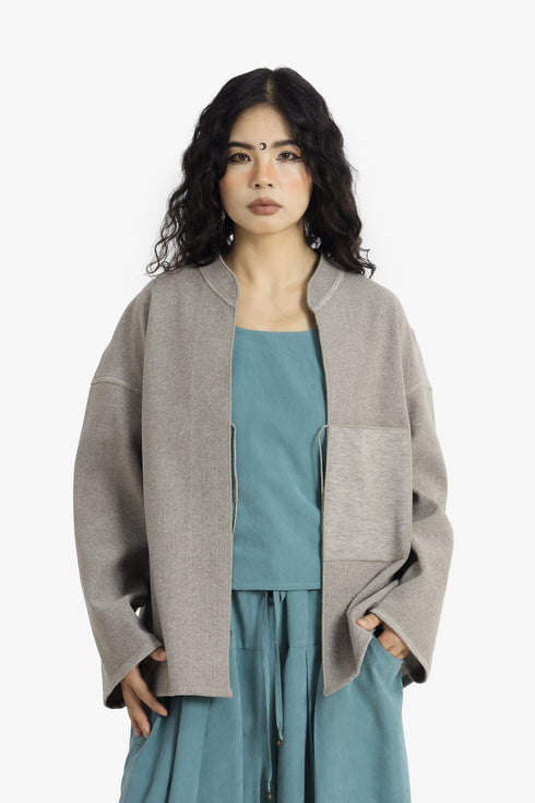 Reversible short jacket with front pocket