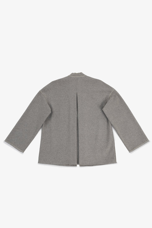 Reversible short jacket with front pocket