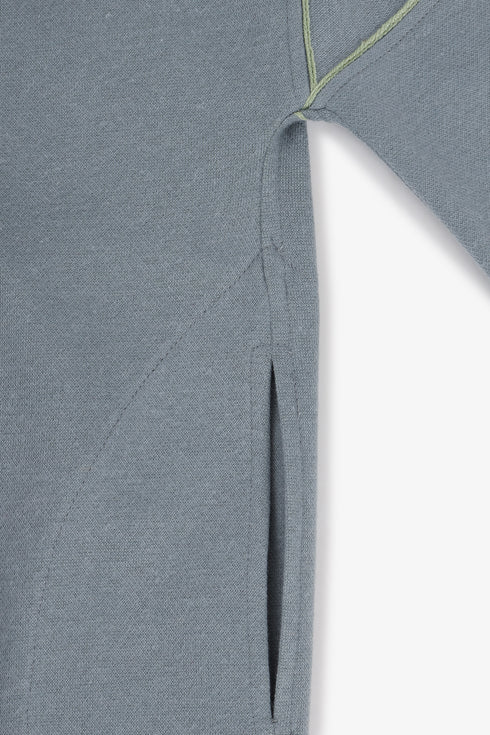 Draped collar coat with contrast stitching