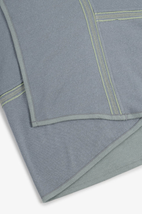 Draped collar coat with contrast stitching