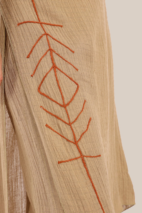 Pants with an embroidered asymmetric skirt