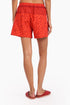 Shorts in printed cotton with front flaps