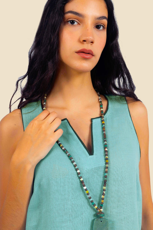 Sleeveless tunic dress in linen with contrasting color trims