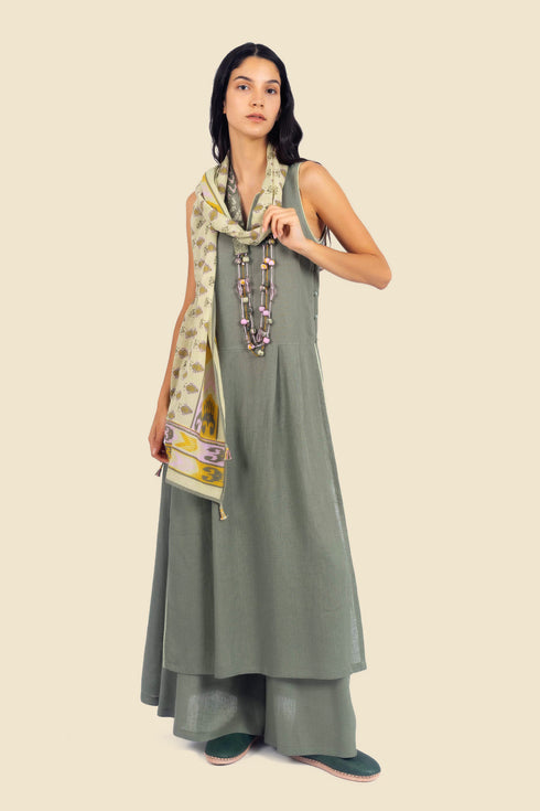 Sleeveless tunic dress in linen with contrasting color trims