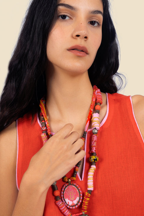 Sleeveless tunic dress in linen with contrasting color trims