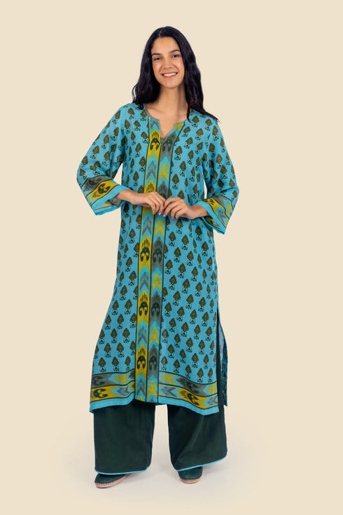 Tunic dress in printed cotton gauze with side slits