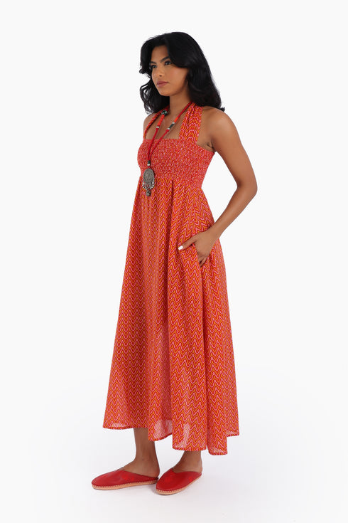 Dress in printed cotton gauze with halter neck tie