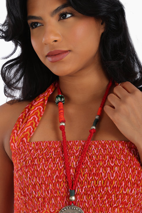 Dress in printed cotton gauze with halter neck tie