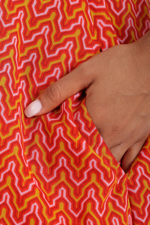 Dress in printed cotton gauze with halter neck tie