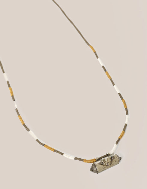 long necklace with antique pendant