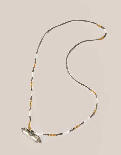 long necklace with antique pendant