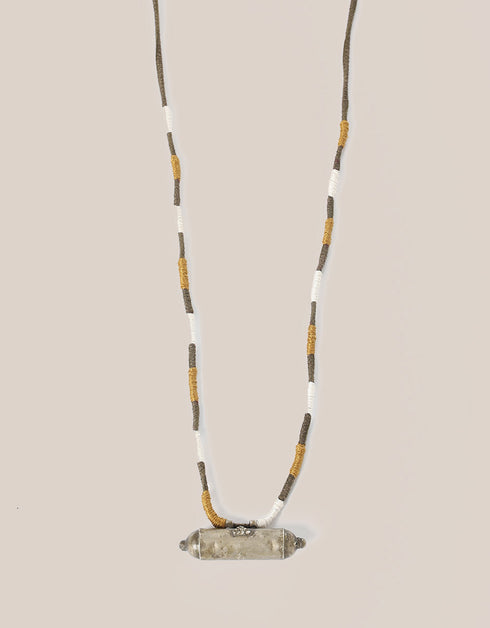 long necklace with antique pendant