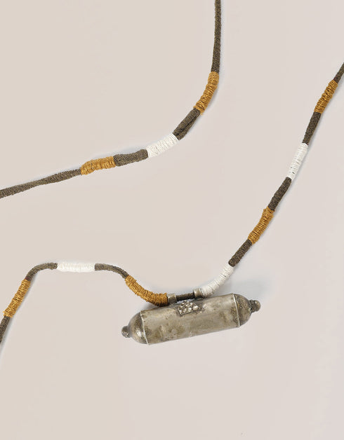long necklace with antique pendant