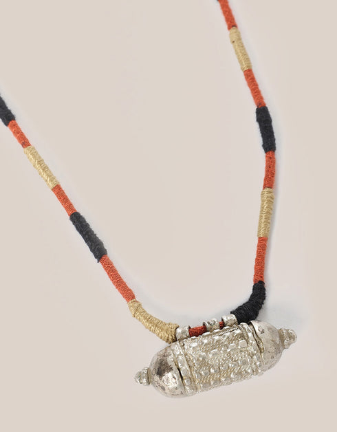 long necklace with antique pendant