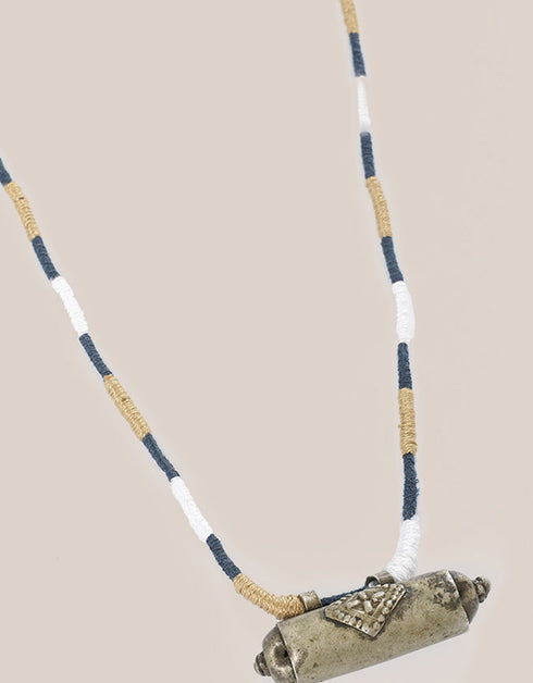 long necklace with antique pendant