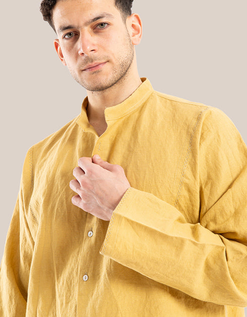 Shirt with decorative stitches and a high round collar