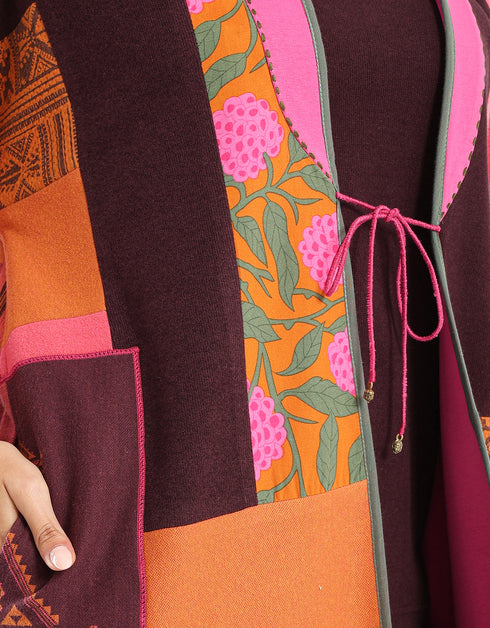 Reversible patchwork coat in mixed textiles with pockets on both sides