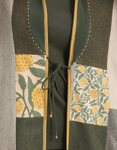 Reversible patchwork coat in mixed textiles with pockets on both sides