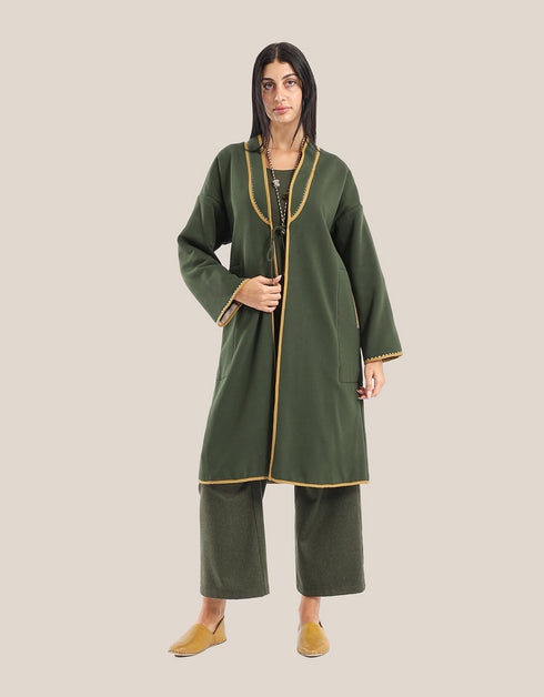 Reversible patchwork coat in mixed textiles with pockets on both sides