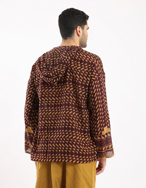 Printed cotton hooded gauze shirt with two front puff pockets.