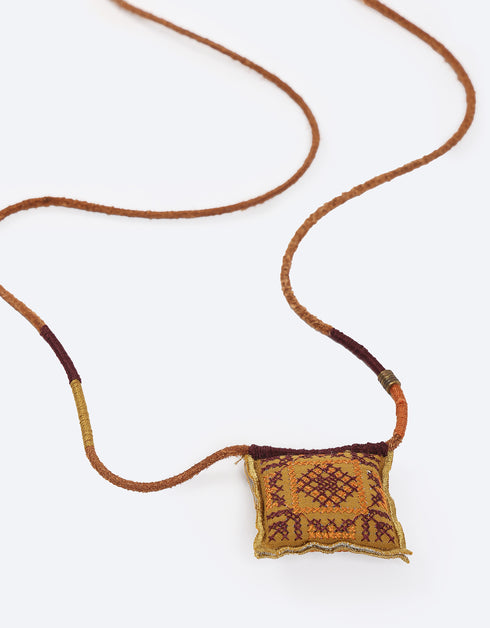 Leather long necklace in leather with embroidered cotton pendant