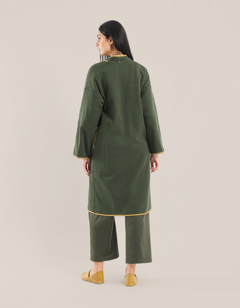 Reversible patchwork coat in mixed textiles with pockets on both sides