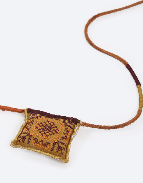 Leather long necklace in leather with embroidered cotton pendant