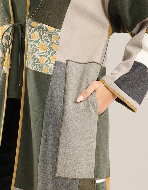 Reversible patchwork coat in mixed textiles with pockets on both sides
