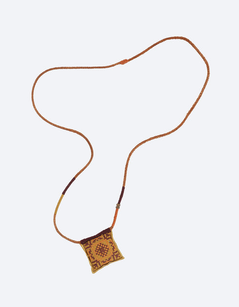 Leather long necklace in leather with embroidered cotton pendant