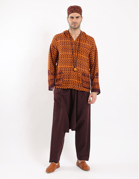 Printed cotton hooded gauze shirt with two front puff pockets.
