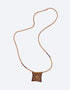 Leather long necklace in leather with embroidered cotton pendant