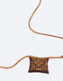 Leather long necklace in leather with embroidered cotton pendant