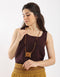Leather long necklace in leather with embroidered cotton pendant