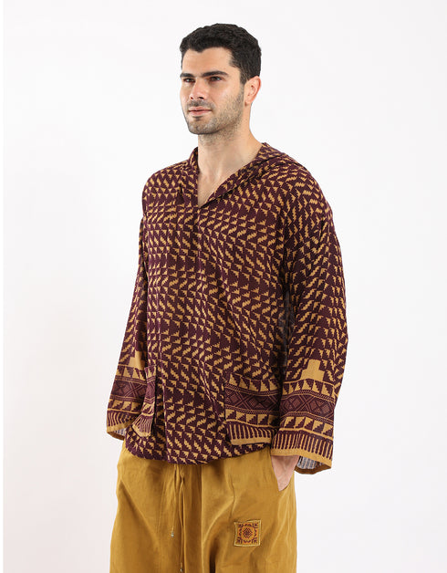 Printed cotton hooded gauze shirt with two front puff pockets.