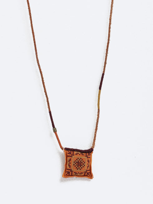 Leather long necklace in leather with embroidered cotton pendant